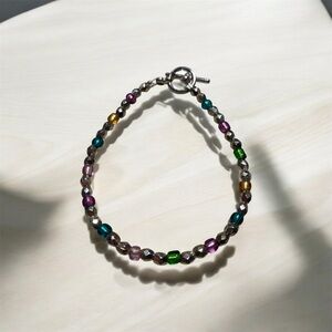 Hand Crafted Purple and Green Beaded Bracelet
